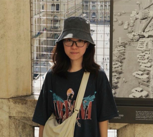 Xiaoyi Wen, wearing a black hat and glasses